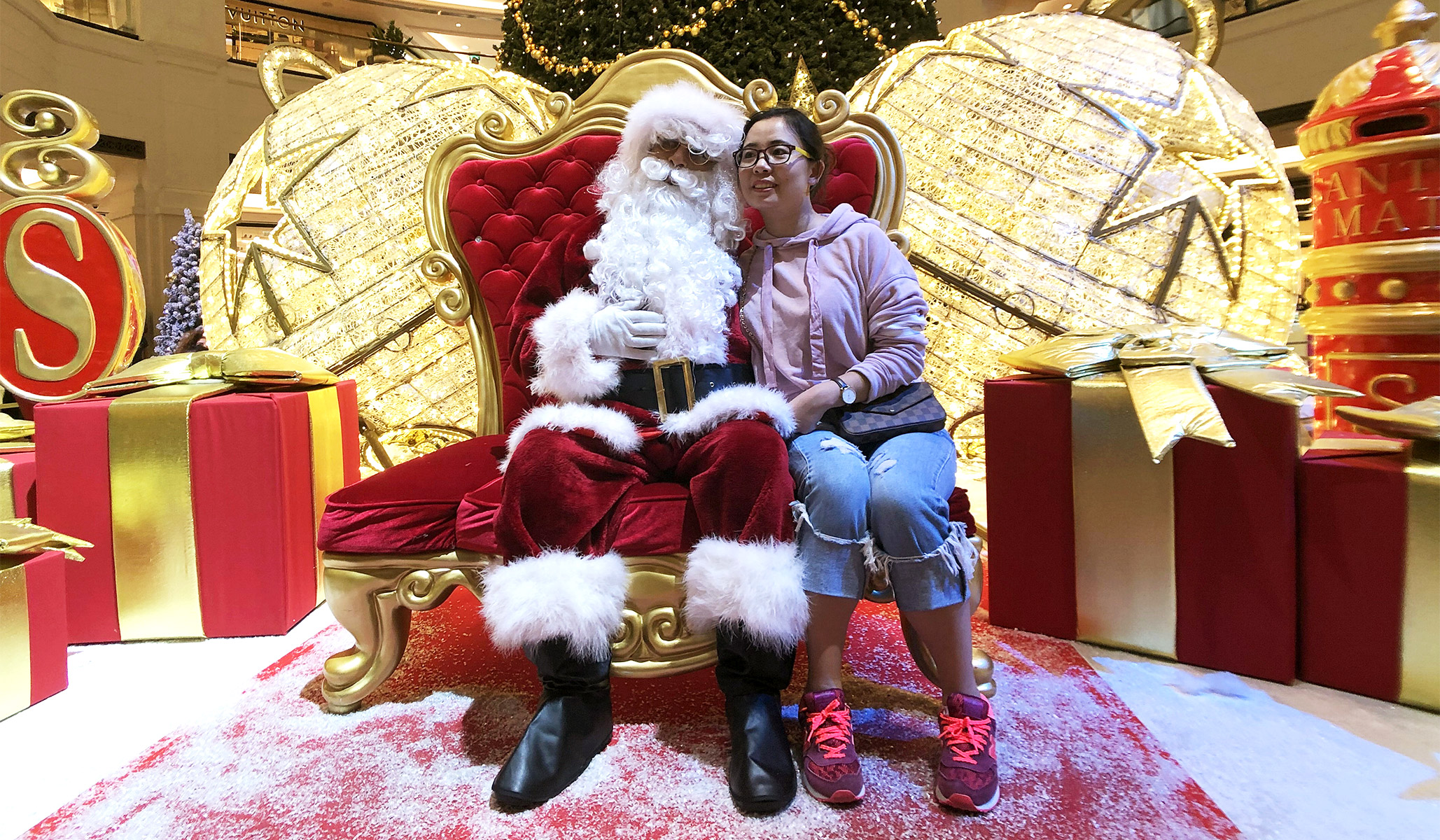 A Washington Redskins cheerleader performs in a Santa Claus